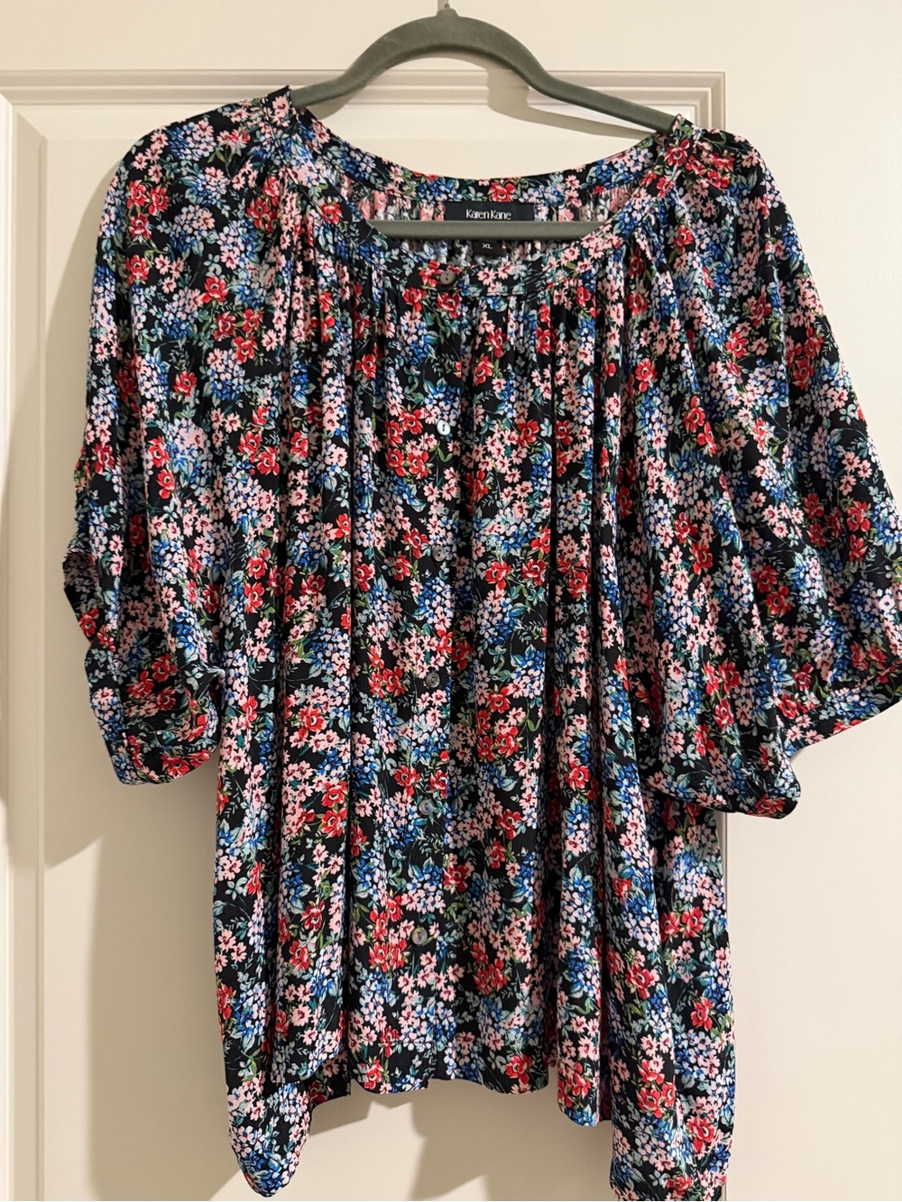 Karen Kane Black Floral Blouse with Red and Blue Accents